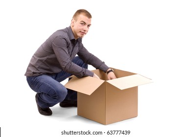 Young Men Reaching Something Inside A Cardboard Box