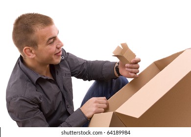 Young Men Reaching Something Inside A Cardboard Box