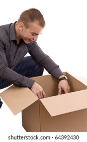 Young Men Reaching Something Inside A Cardboard Box