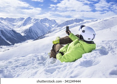 Young Men With Smartphone Mountain Winter Resort