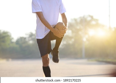 Young Men Warm Up To Run