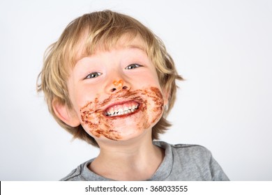 Young Messy Boy With Chocolate On His Face