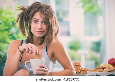 Young Messy Woman Have Breakfast In The Kitchen