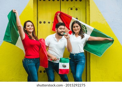 Young Mexican People With Flags Celebrating Cinco De Mayo In Mexico City