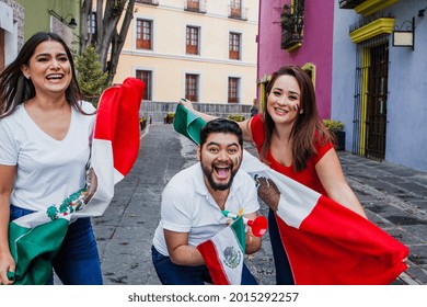 Young Mexican Soccer Fans Holding Flags In Mexico