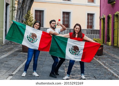 Young Mexican Soccer Fans Holding Flags In Mexico