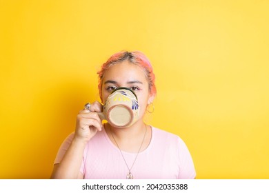 Young Mexican Woman Drinking Mexican Coffee In Colorful Cup