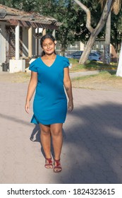 Young Mexican Woman Walking On The Street