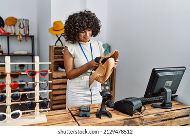 Young Middle East Shopkeeper Woman Smiling Happy Working At Clothing Store.