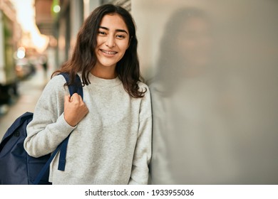 Young middle east student girl smiling happy standing at the city.