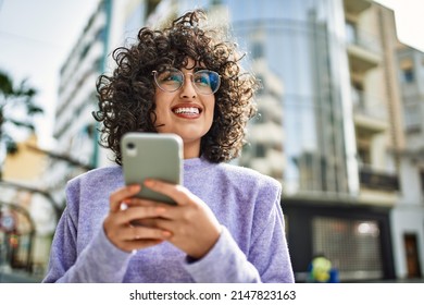 Young Middle East Woman Smiling Confident Using Smartphone At Street