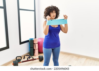 Young Middle East Woman Training Using Elastic Band At Clinic