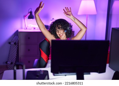 Young Middle Eastern Woman Streamer Playing Video Game Dancing At Gaming Room