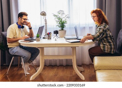 Young Millennial Couple Working At Home. Concept Of Freelance And Remote Work