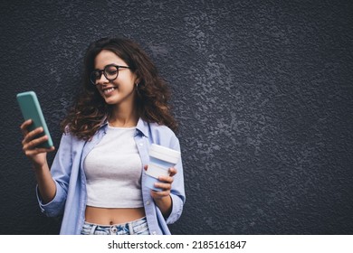 Young Millennial Woman Texting Message On Smartphone App. Female Chatting In Social Network On Copy Space Background. Influencer Reading Notification On Mobile Phone. Online Payment And Web Browsing