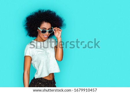 Similar – Image, Stock Photo Happy mixed woman with curly hair standing on the street