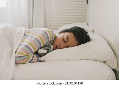 Young Mixed Race Asian Girl Sleeping In Bed With Her Soft Toy, Good Night Sleep, Bedtime Routine, Wake Up Kid For School, Children Sleep Disorder, Being Sick Concept