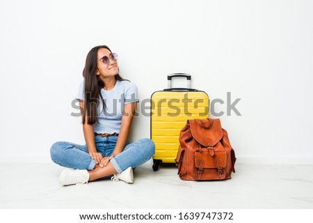 Young mixed race indian woman ready to go to travel dreaming of achieving goals and purposes