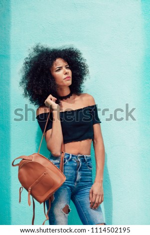 Similar – Image, Stock Photo Happy mixed woman with curly hair standing on the street