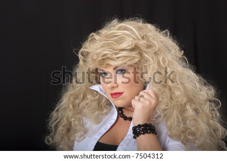 A young model in blonde wig posing for the camera