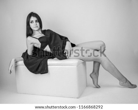 Similar – Image, Stock Photo Young brunette woman in black lingerie lying on the floo