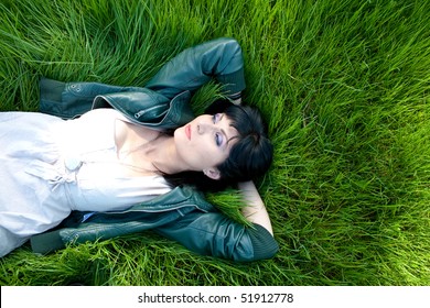 Young model laying in the grass