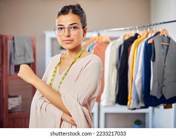 Young Modern Confident Indian Asian Entrepreneur woman or female working professional fashion designer is standing at boutique store looking at camera. women empowerment, New Business Start up concept