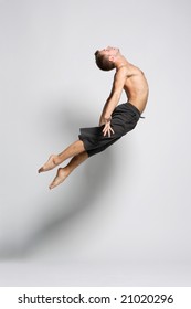 Young Modern Dancer Posing Over White Background