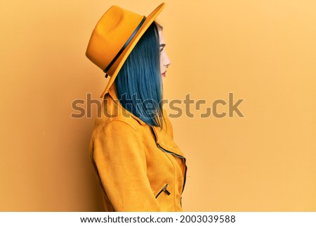 Similar – Attractive girl with a hat over a yellow wall