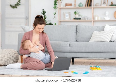 Young Mom Breastfeeding Baby While Working Remotely On Laptop At Home, Copy Space