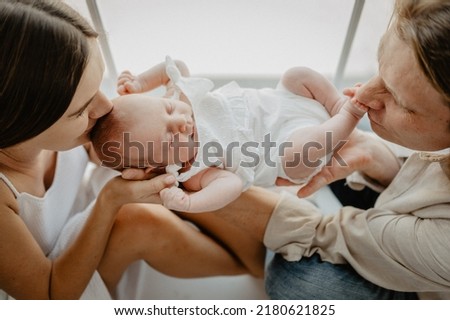 Similar – Mother hugging her newborn baby girl