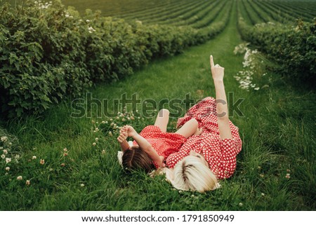 Similar – Foto Bild Junge Frau ruht auf einem Weizenfeld.