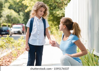 Young Mom Saying Goodbye To Her Son Before School