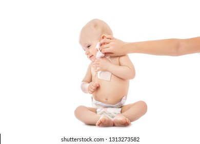 Young Mom Wiping The Baby Skin Body And Face With Wet Wipes Carefully On White Background. Concept Cleaning Wipe, Pure, Clean.