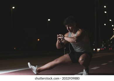 A Young Moroccan Athlete Training At Night On A Public Road.