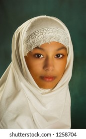 Young Moroccan woman in a white veil