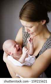 young mother and the baby cry together