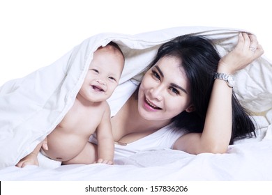 Young Mother And Baby Playing And Smiling Under A Blanket