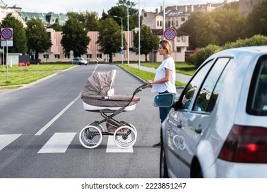 Young Mother With The Baby Pram Is Walking By The Crosswalk. Concepts Of Safety And Traffic Code.