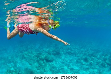 Young Mother With Child In Snorkeling Mask Dive In Coral Reef Sea Lagoon To Explore Underwater World. Family Travel Lifestyle In Summer Adventure Camp. Swimming Activities On Beach Vacation With Kids.