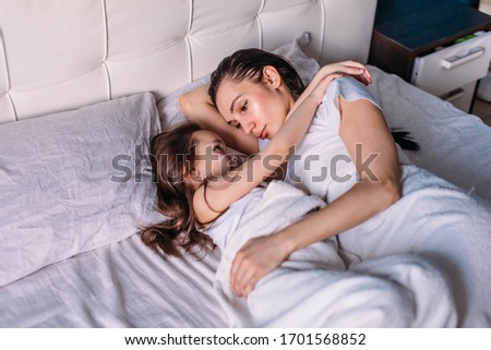 Similar – Image, Stock Photo Man with wife watching his sleeping son