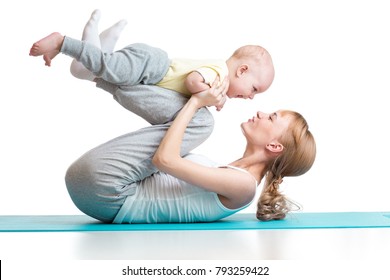 young mother does fitness exercises together with baby boy isolated on white