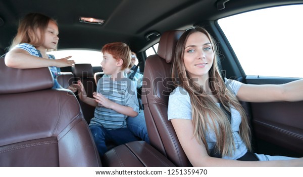 young mother driving a\
car