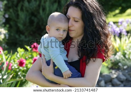 Similar – Image, Stock Photo mother with her daughter asleep in her arms