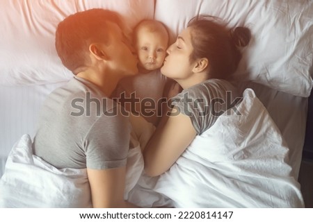 Similar – mother and child son sleeping together in bed