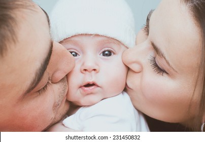 Young Mother And Father With Newborn