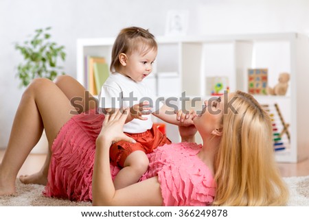 young mother with her baby having fun pastime