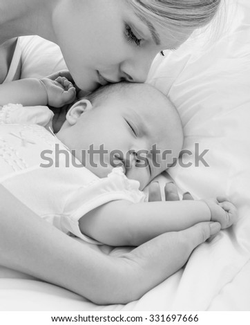 Similar – Mother and cute little baby girl sleeping