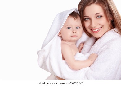 Young mother with her baby in a white towel - Powered by Shutterstock