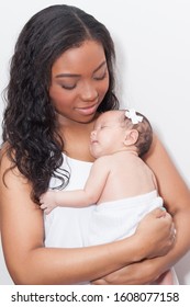 Young Mother With Her Newborn Baby.